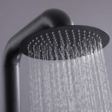 Close-up of circular shower head with even water spray.