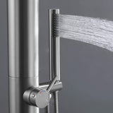 Close-up of the handheld stainless steel showerhead spraying water from the side of the column.