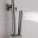 Gunmetal gray handheld shower sprayer with water flow, mounted on a modern gray tile wall